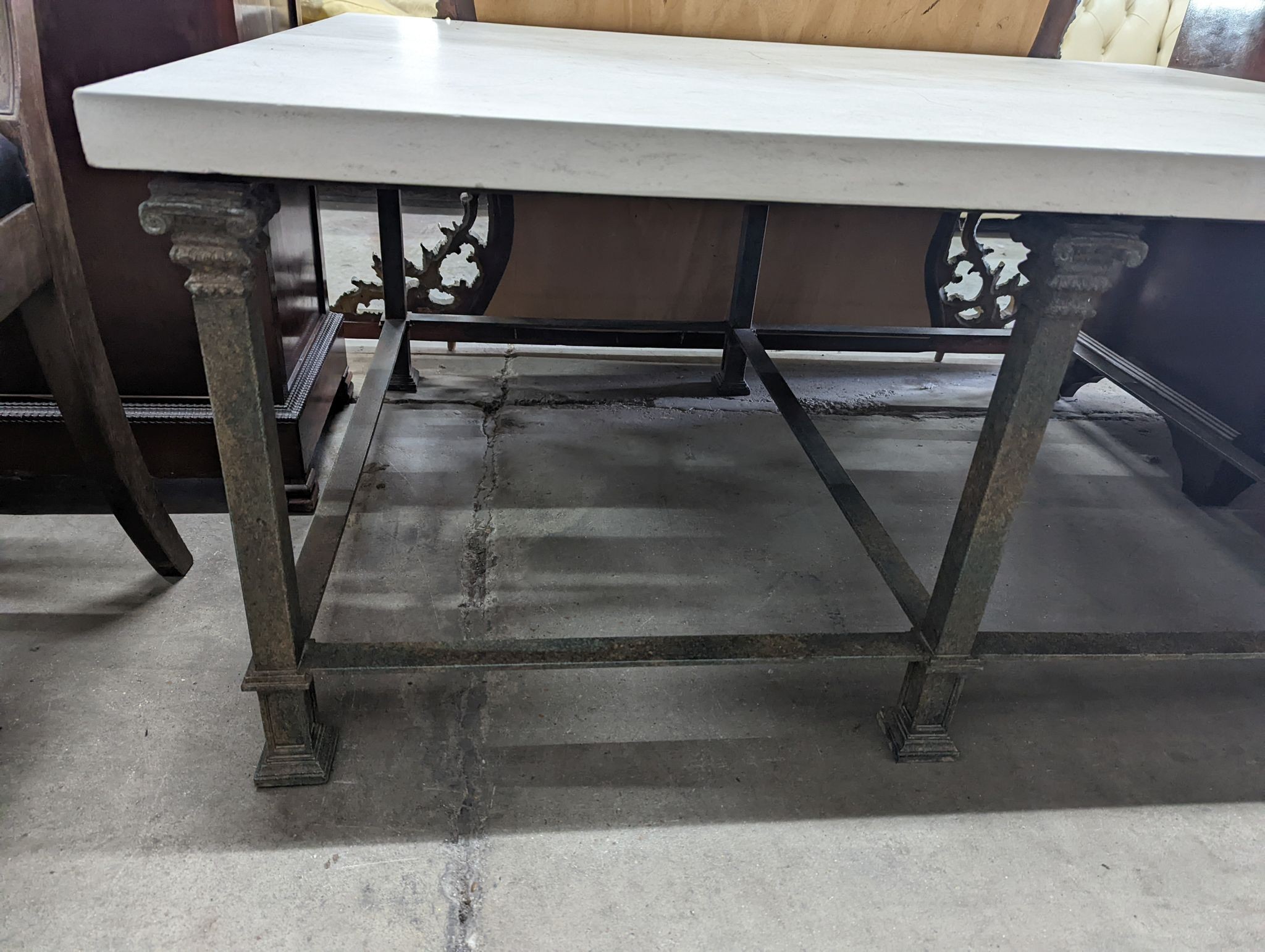 A contemporary heavy marble topped wrought iron rectangular coffee table, length 122cm, depth 91cm, height 54cm